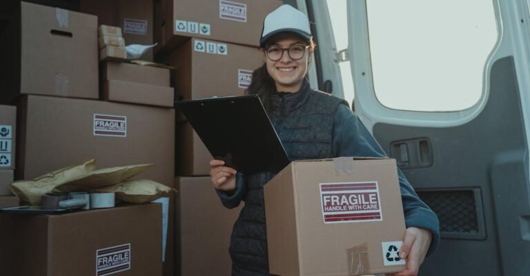 A cheerful delivery woman prepares parcels inside a van, ensuring careful handling.